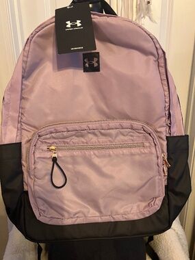 This is a mauve pink and black Under Armour Women's Favorite Backpack